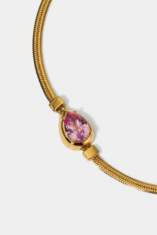 CLOSE UP OF THE PEAR STONE ON THE DELANCEY PINK PEAR LINE BRACELET