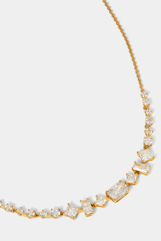 CLOSE UP DETAIL SHOT OF THE RARE JEWELS FRONTAL NECKLACE IN GOLD PLATING.