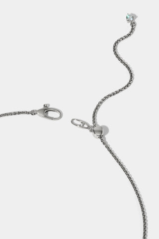 CLOSE UP OF THE CLASP ON THE LUCIA FRONTAL V NECKLACE, SHOWING A RHODIUM CHAIN WITH AN ADJUSTABLE EXTENSION FINISHED WITH A CZ STONE AT THE END