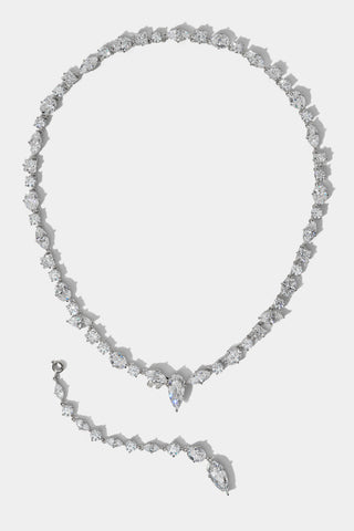 THE RIVIERA CONVERTIBLE Y NECKLACE IN RHODIUM PLATING, WITH THE Y-DROP ATTACHMENT REMOVED AND PLACED ON THE SIDE OF THE COLLAR
