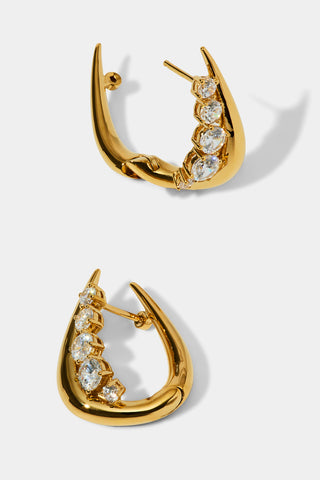DETAIL IMAGE OF PHENOM HUGGIE EARRINGS IN GOLD PLATING