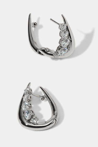 SIDE DETAIL VIEW OF PHENOM HUGGIE EARRINGS IN RHODIUM PLATING