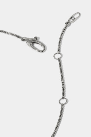 CLOSE UP OF THE CLASP ON THE LUCIA LINEAR PENDANT NECKLACE, SHOWING A RHODIUM CHAIN WITH EXTENSION LINKS
