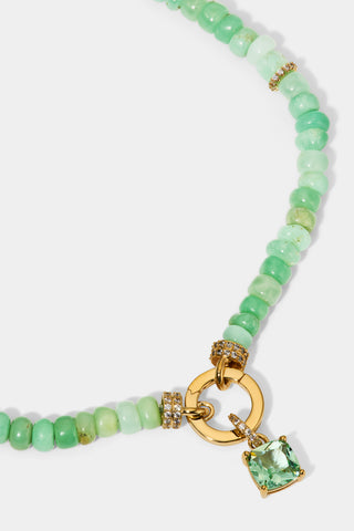 CLOSE UP OF THE CUSHION CHARM ON THE BEADS OF PARADISE GREEN CUSHION PENDANT NECKLACE