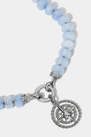 CLOSE UP OF THE MEDALLION ON THE BEADS OF PARADISE NAUT PENDANT NECKLACE