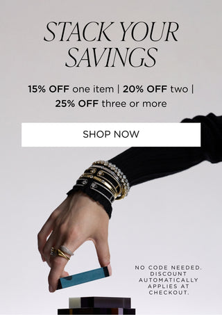 Promotional banner with the text 'STACK YOUR SAVINGS' and discount information "15% off one item, 20% off two, 25% off three or more",  plus a hand wearing stacked bracelets and rings holding a small stack of colorful rectangular items against a light gray background