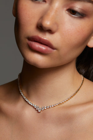 CLOSE UP OF MODEL WEARING STELLAR CZ SLIDER COLLAR NECKLACE