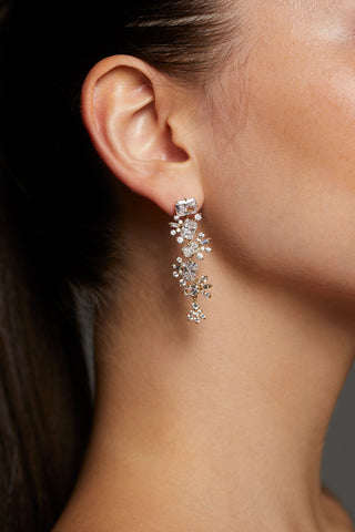SIDE PROFILE OF MODEL WEARING STELLAR CASCADE CZ LINEAR EARRINGS 