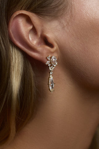 CLOSE UP OF A MODEL'S EAR WEARING THE CANNES DROP EARRINGS