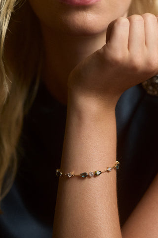 CLOSE UP A MODEL’S WRIST WEARING THE HERA MULTI LINE BRACELET