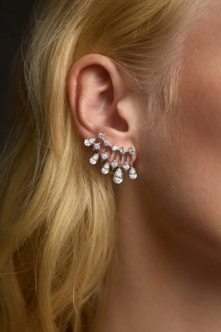 CLOSE UP OF A MODEL’S EAR WEARING THE HERA CLIMBER EARRINGS