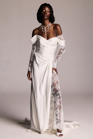 A MODEL POSING IN A WEDDING DRESS,  WEARING THE PEARL CHOKER LOW DROPS NECKLACE
