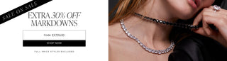 Sale on sale. Extra 30% off markdowns with code EXTRA30. Full price styles excluded. Image of model wearing cubic zirconia necklaces with clear and black stones.