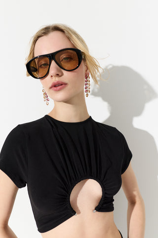MODEL LOOKING AT THE CAMERA WEARING A BLACK TOP, SUNGLASSES, AND THE MOJITO PINK DOUBLE LINEAR EARRINGS 