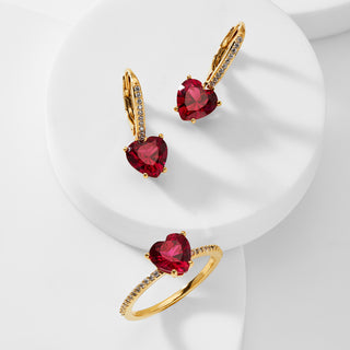 Image of ruby colored heart shaped CZ drop earrings and ruby colored heart shaped ring.